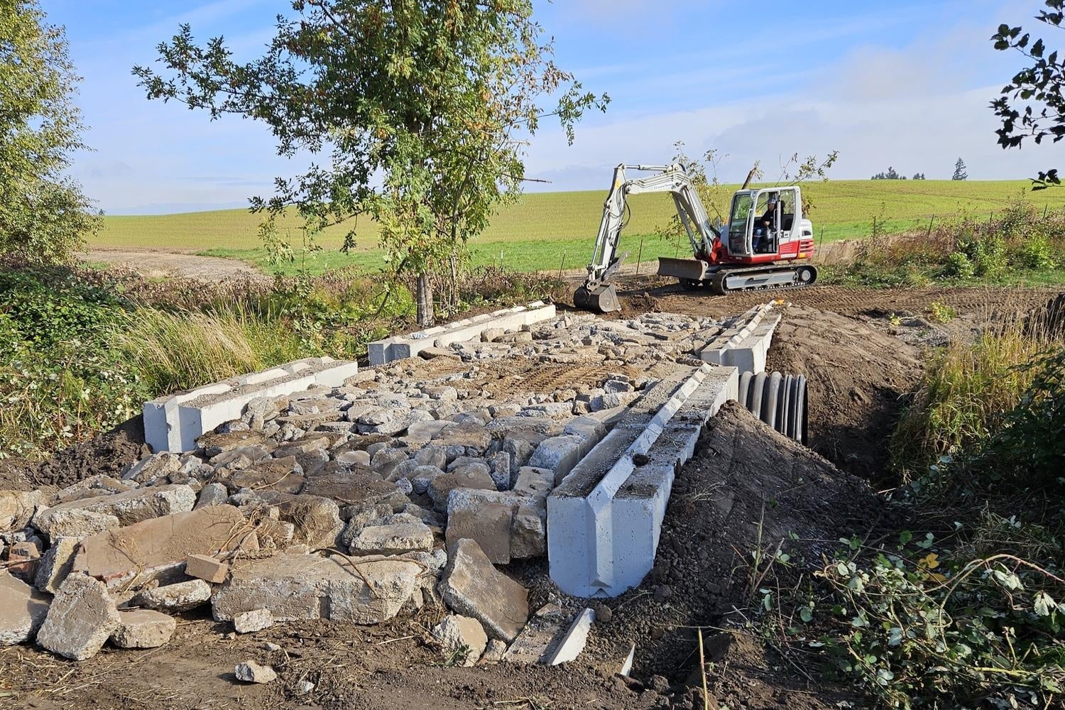 Excavator rocks and bridge